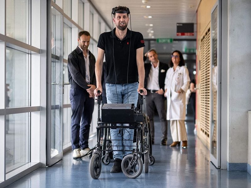 Groundbreaking: Brain, spine implants help paralysed man walk again