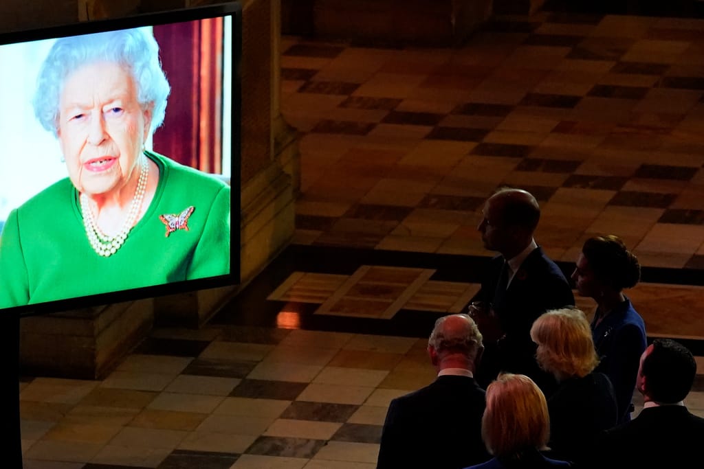 Queen Elizabeth makes a video message to attendees of an evening reception to mark the opening day o