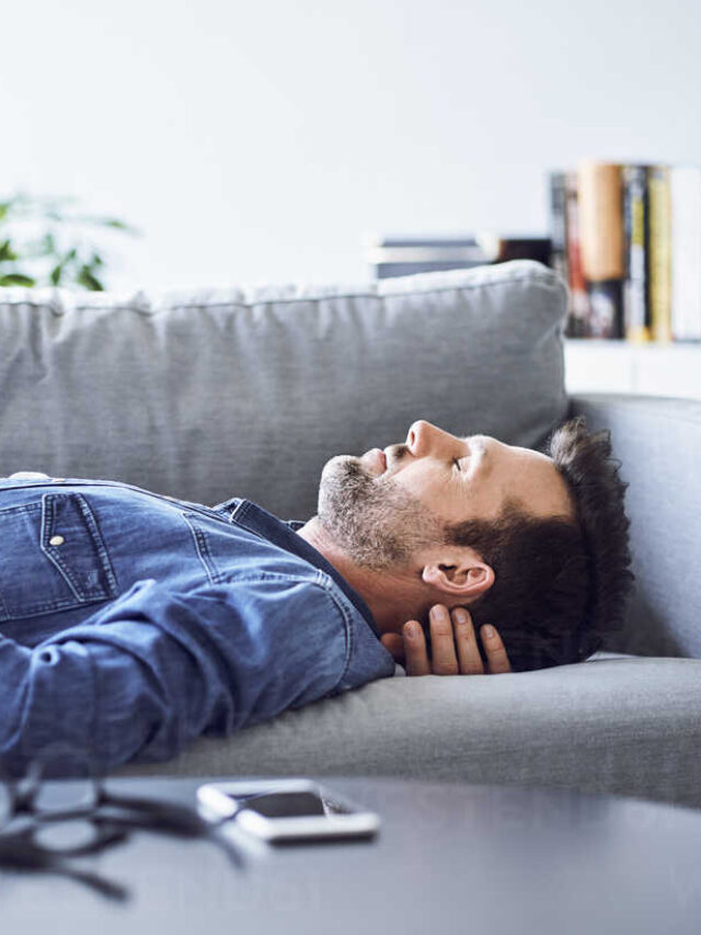 cropped-relaxed-man-sleeping-on-sofa-BSZF00296.jpeg