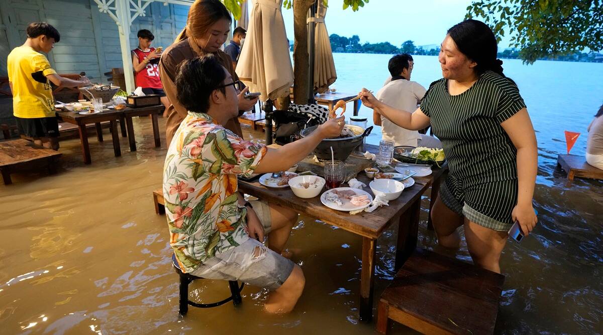 At flooded restaurant near Bangkok, the special is a splash