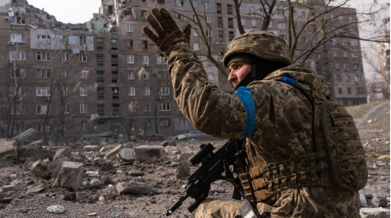 Russia evacuates occupied Ukrainian city, orders martial law