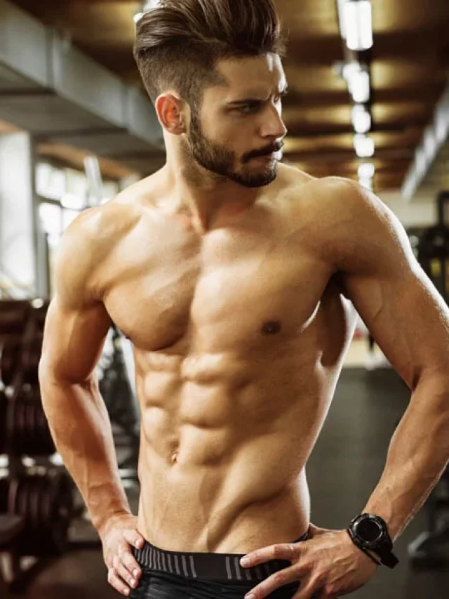Muscular-Man-With-Ab-Muscles-Standing-In-A-Gym
