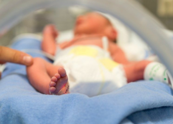 First baby with DNA from three people born in the UK