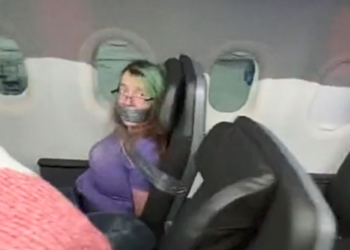 Watch: San Antonio woman duct-taped to American Airlines seat after trying to open door in flight sued for unpaid fine