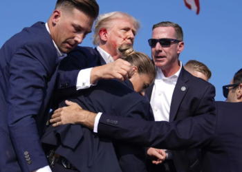 Former President Donald Trump’s campaign announced that he is "fine" following a shooting at his rally in Butler, Pennsylvania. According to local authorities, the suspected gunman and at least one attendee have been confirmed dead.