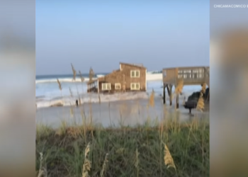 Outer Banks, North Carolina — A picturesque home on the idyllic shoreline of the Outer Banks dramatically collapsed into the sea, its pilings succumbing to the relentless forces of nature. Hurricane Ernesto's wrath According to weather experts, the combination of crashing waves generated by Hurricane Ernesto and unusually high tides appear to be the primary culprits behind the collapse, as reported by the New York Times. Collin Rugg, co-owner of Trending Politics, shared a video of the catastrophic event on his official X handle on Sunday. "Beachfront Home falls into the Atlantic Ocean on North Carolina’s Outer Banks. The incident was thanks to Hurricane Ernesto, which is off the coast in the Atlantic. The unfortunate owners purchased the 4-bed, 2-bath home in 2018 for $339,000. The home was built in 1973," he stated in his post. https://twitter.com/CollinRugg/status/1824889708541010096 Repeated incidents raise alarm The National Park Services confirmed that this is the seventh such incident in Rodanthe over the past four years. They urged visitors to avoid the beaches near the Cape Hatteras National Seashore, as reported by The Guardian. Access from Rodanthe to Jug Handle Bridge has been restricted due to debris washing ashore from the collapse. Jagged metal fragments and wooden planks, some embedded with nails, now pose significant hazards to the public. Widespread damage Officials noted that several other homes in the Rodanthe area also appear to have sustained damage. “Dangerous debris may be present on the beach and in the water for more than a dozen miles," officials were quoted as saying by The Guardian. An alert from the park service warned of "exposed hazards, such as house-related septic systems, wires, pipes, and broken concrete parking pads." The collapse has highlighted the urgent need for robust coastal management and climate resilience measures. As the frequency of such incidents increases, residents and visitors alike are advised to exercise extreme caution when near affected areas. For now, the Outer Banks' scenic beauty is marred by the aftermath of Hurricane Ernesto, serving as a stark reminder of nature's unforgiving power.