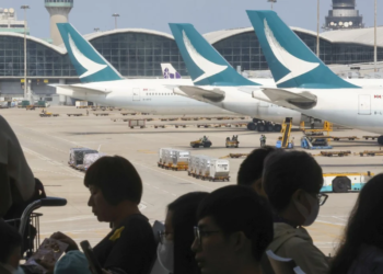 Watch: Cathay Pacific bans couple who kicked woman for reclining her chair