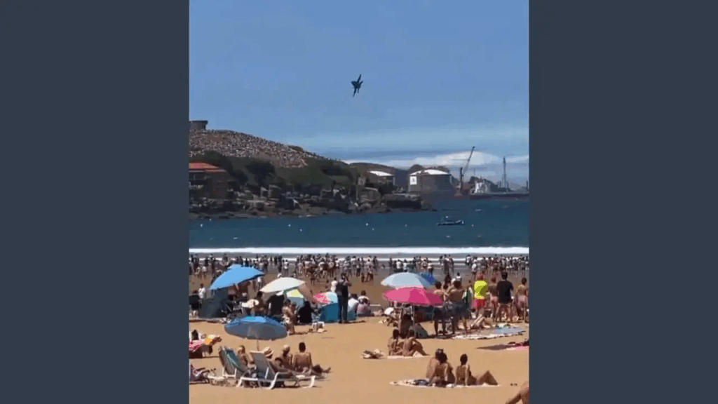 Watch: Spanish Fighter Jet Nearly Crashes Into Beach Crowd During Airshow