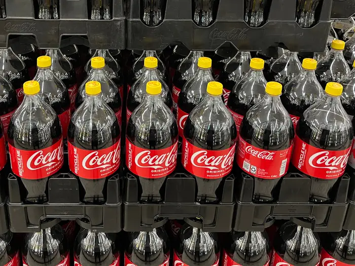 Why Do Coca-Cola Bottles Have Yellow Caps Again?