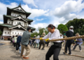Around 1,800 people in northern Japan have come together to help move the massive Hirosaki Castle, using a centuries-old Japanese technique that allows traditional wooden structures to be relocated without dismantling them. The 396-ton castle was moved slightly more than two meters toward its original position as restoration work nears completion. The unusual operation has turned the historic landmark's preservation into a community event, drawing thousands of people who wanted to take part.