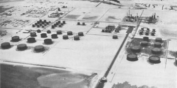 Aerial view of storage tanks and processing units at the Ras Tanura refinery on Saudi Arabia's Gulf coast