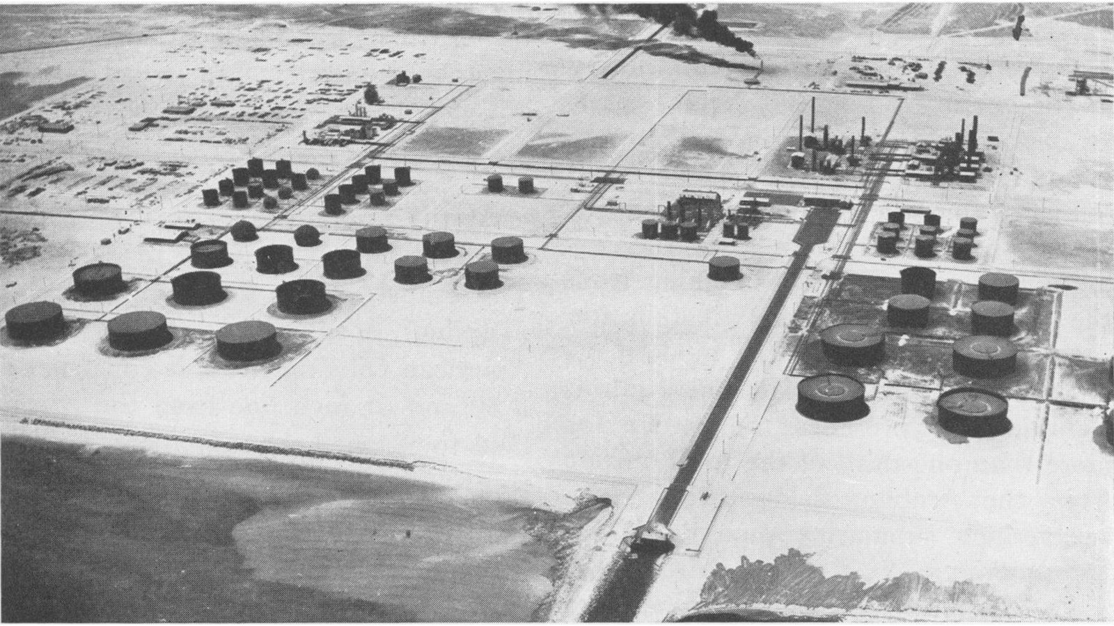 Aerial view of storage tanks and processing units at the Ras Tanura refinery on Saudi Arabia's Gulf coast