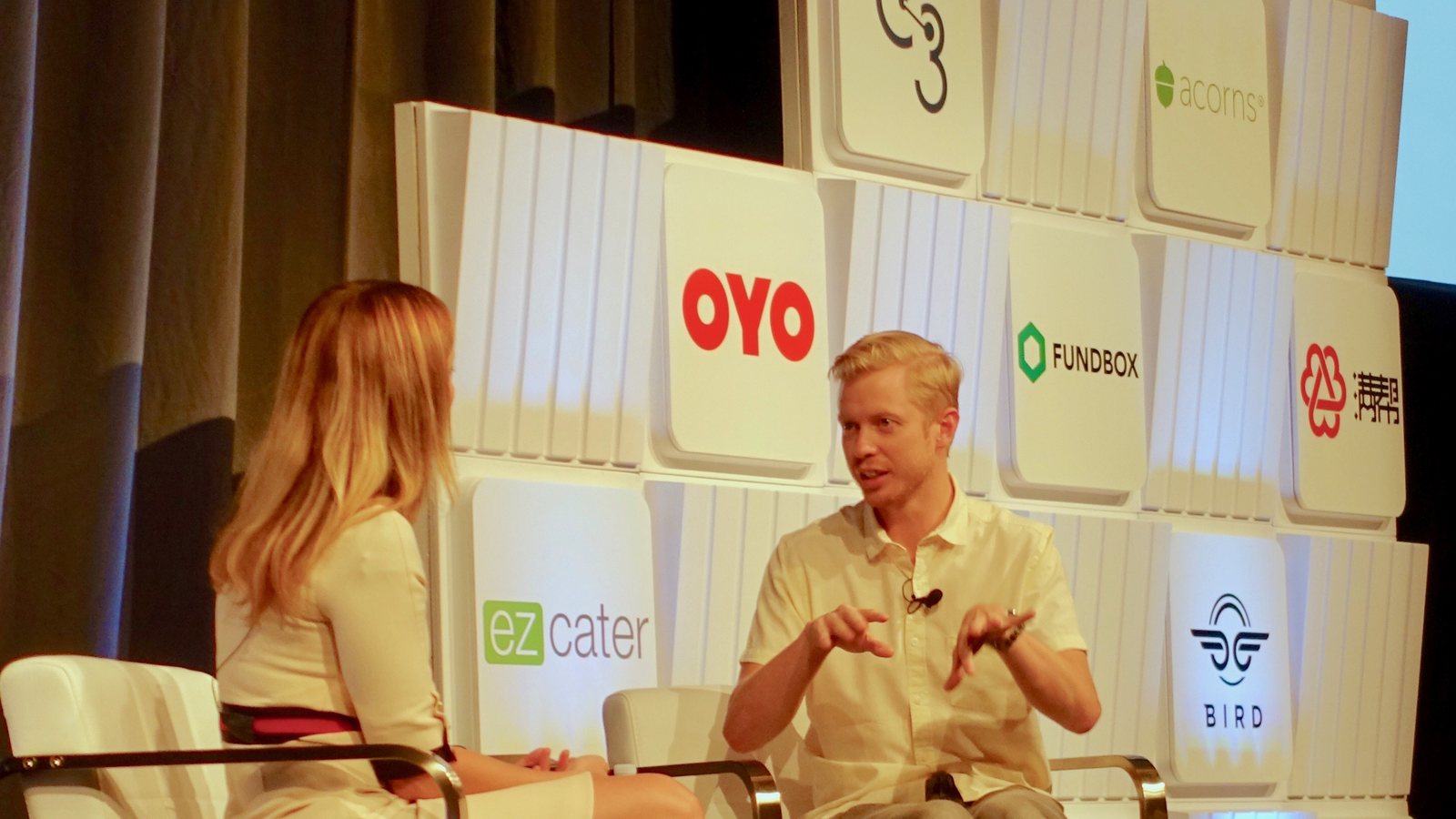 Reddit CEO Steve Huffman, seated on stage, gestures as he speaks during an interview at a Goldman Sachs conference in 2018