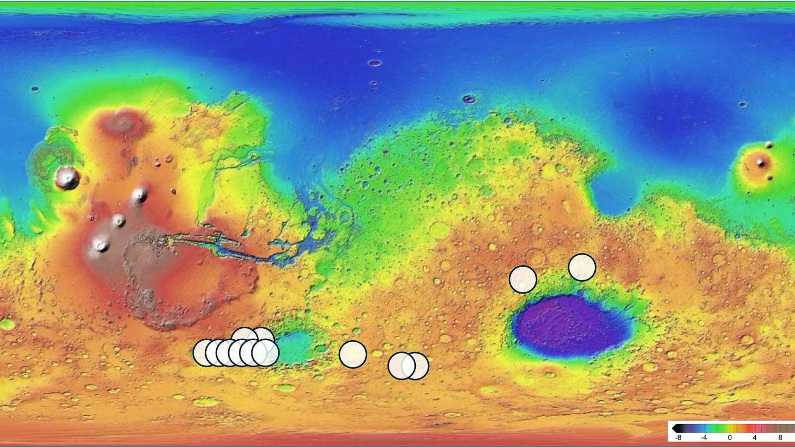 Color-coded elevation map of Mars with white circles marking 13 sites, mostly in the southern highlands, whose chemistry matches the Teghaza 001 meteorite