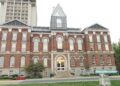 The red-brick Main Building of the University of Kentucky in Lexington, with a taller campus tower behind it