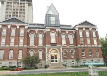 The red-brick Main Building of the University of Kentucky in Lexington, with a taller campus tower behind it