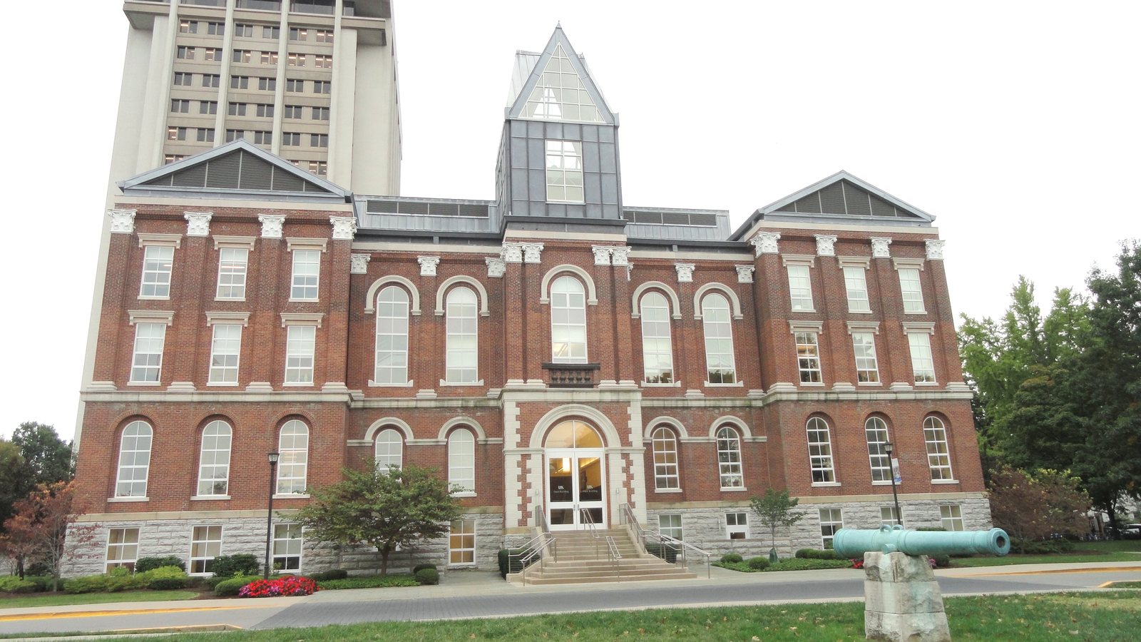 The red-brick Main Building of the University of Kentucky in Lexington, with a taller campus tower behind it