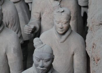 Close-up of clay Terracotta Army warriors standing in rows in Pit 1 near Xi'an, China
