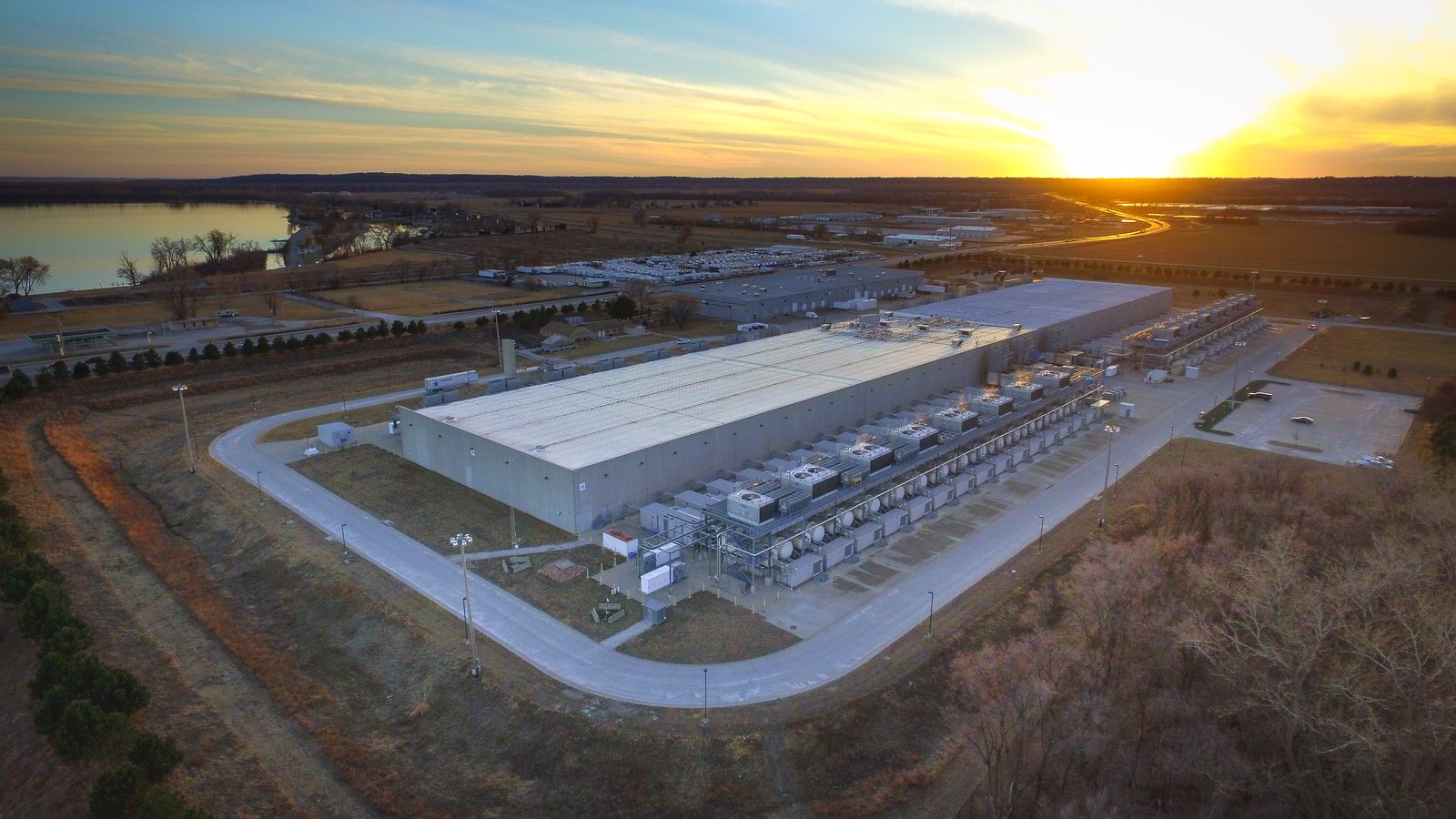 Aerial view of a Google data center building in Council Bluffs, Iowa, at sunset