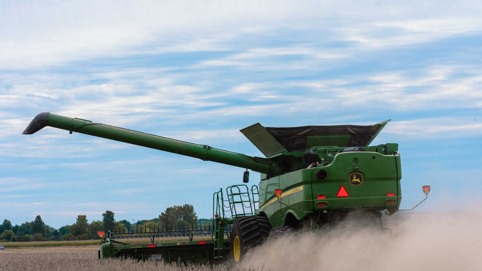 A combine harvesting soybeans on an Indiana farm