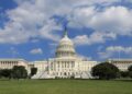 The west front of the US Capitol in Washington under a blue sky