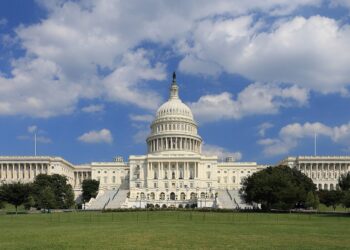 The west front of the US Capitol in Washington under a blue sky