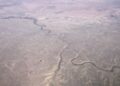 Aerial view of dry rangeland in Uintah County, Utah, with the White River winding across the middle