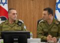 Israeli army chief Eyal Zamir, in olive uniform, sits at a conference table beside another senior officer, with Israeli flags behind them